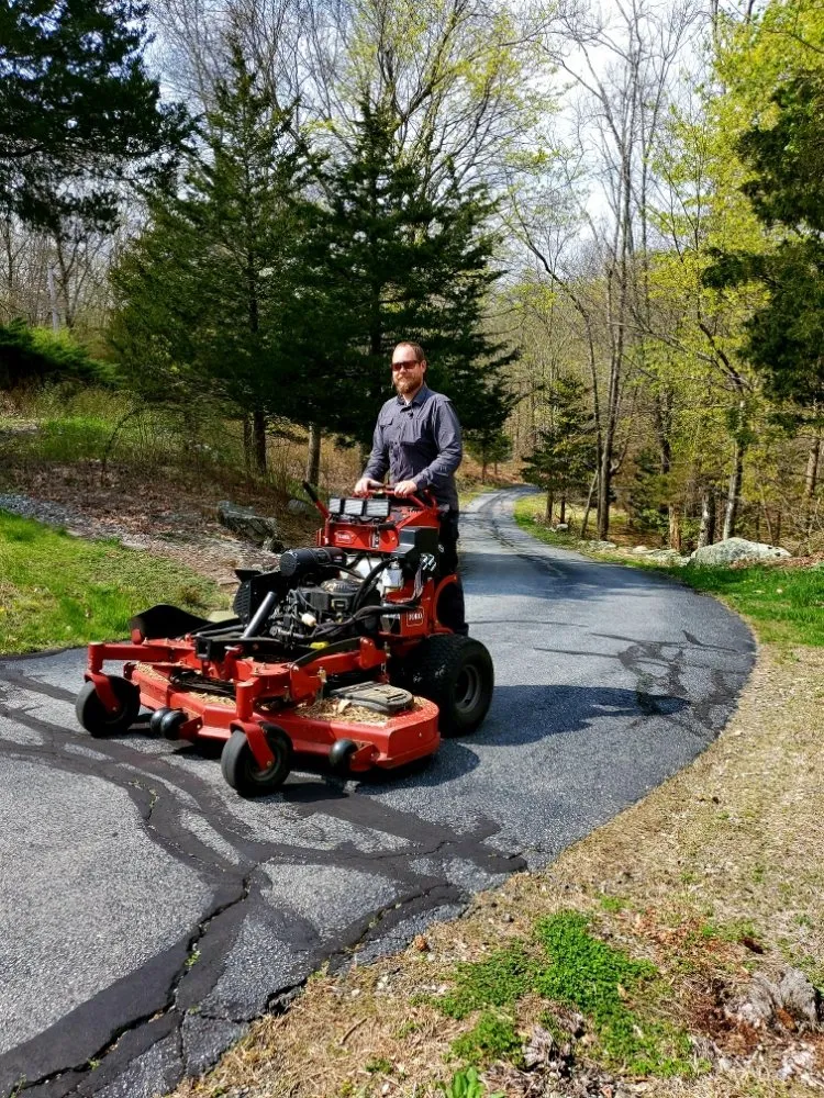 Custom yard cleanup service for year-round maintenance in New London, CT by Scott's Family Landscaping