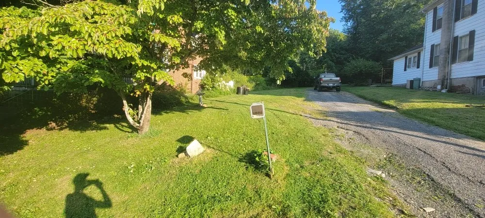 Expert lawn mowing service for residential properties in Buchanan, VA by Seans Landcare