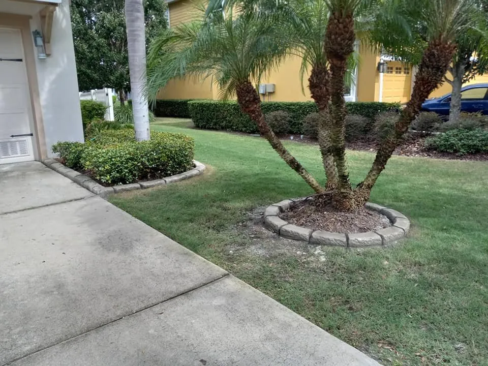 Custom landscape design in Wimauma, FL by Second 2 None Artisan Landscape Curbing