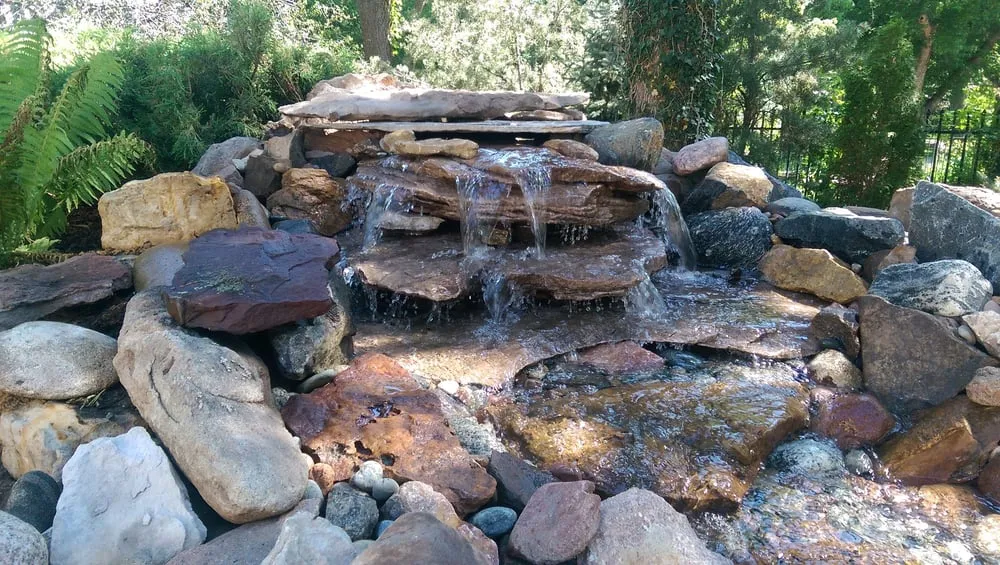 Expert outdoor landscaping for year-round maintenance in Colorado Springs, CO by Serenity Falls Water Features