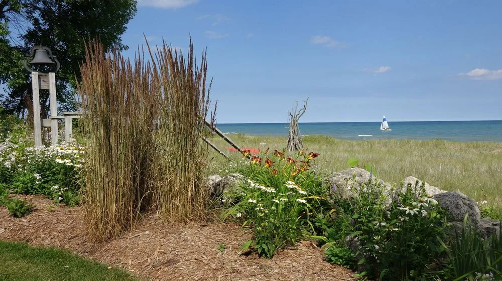 Custom lawn mowing service for beautiful yards in Sheboygan, WI by Serenity Farm Landscaping