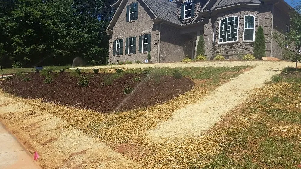 Professional garden landscaping for homes in Tobaccoville, NC by Sharp Edge Lawn Care & Management