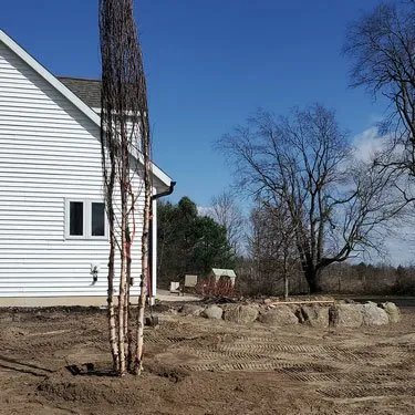 Custom residential landscaping with custom design in Sparta, MI by Shear Outdoors