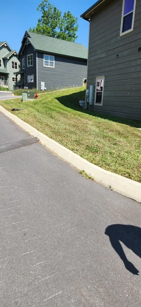 Trusted lawn mowing service for residential properties in Washburn, TN by Shular Wood