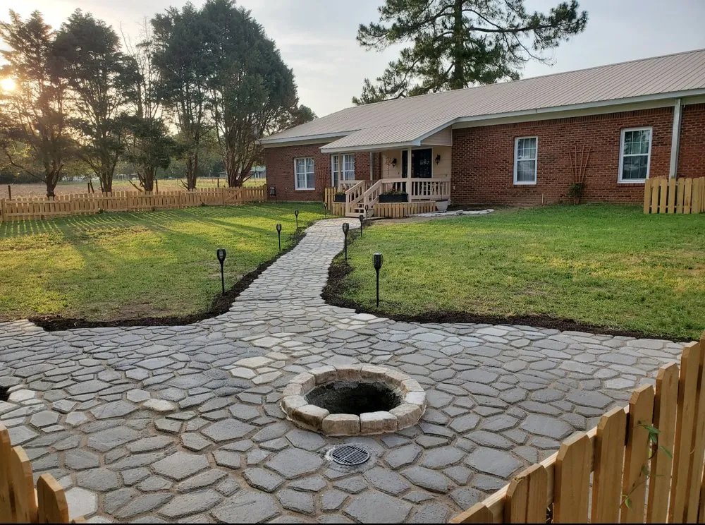 Custom landscape installation for year-round maintenance in Daleville, AL by Signature Lawn & Landscape