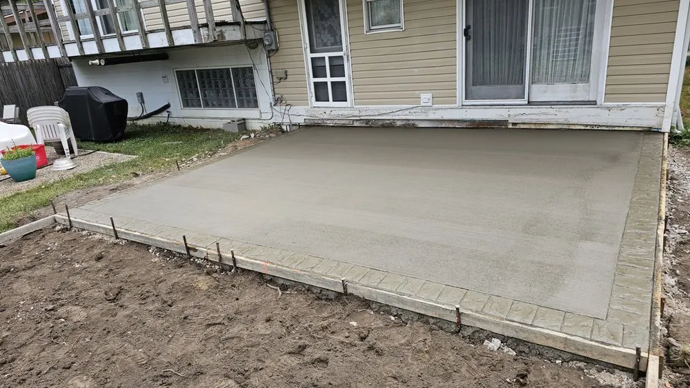 Custom landscape design in Holland, OH by Simple Solution Concrete