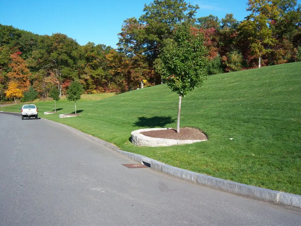 Professional landscape installation for residential properties in Wrentham, MA by Simply Safer Premium Lawn Care