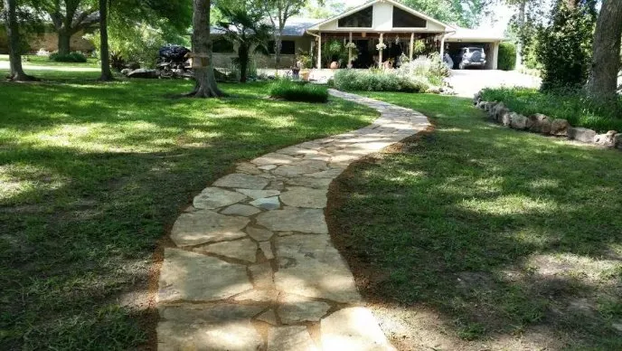 Custom garden landscaping for year-round maintenance in Bonham, TX by Sirelio's Landscaping Services