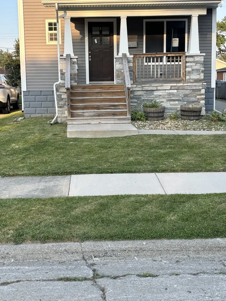 Expert lawn care service for residential properties in Detroit, MI by Sly & Lids Property Preservation & Landscapes