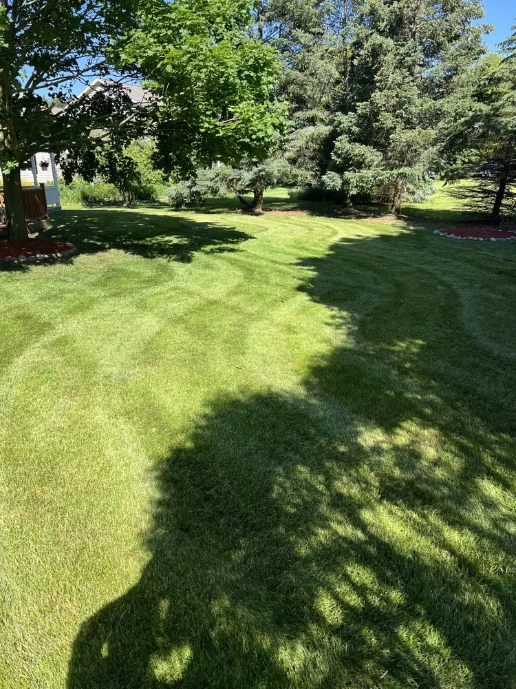 Professional landscaping services for homes in Pewaukee, WI by Small Town Service’s