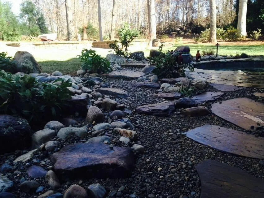 Affordable yard cleanup service with custom design in Whitsett, NC by Smart Scapes