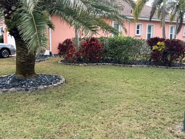 Affordable landscape installation in Melbourne, FL by Smilin' Curbs