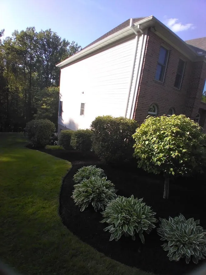 Custom landscape installation in Hydes, MD by Smith Services Landscapes