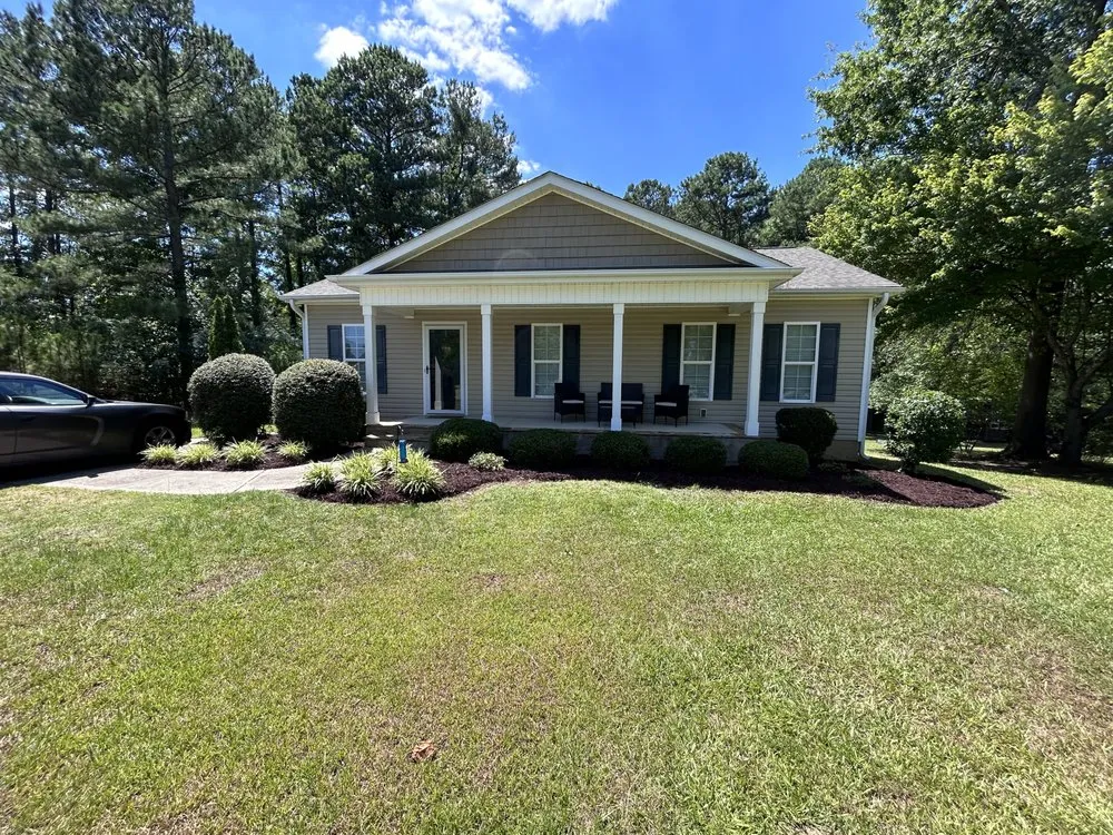 Affordable yard cleanup service with custom design in Apex, NC by Smitten Lawns