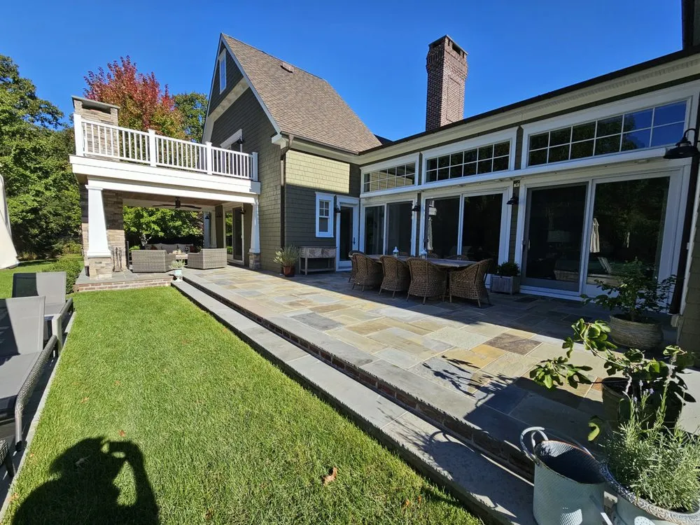 Professional landscape installation for beautiful yards in Aquebogue, NY by Soil & Stone Landscapes