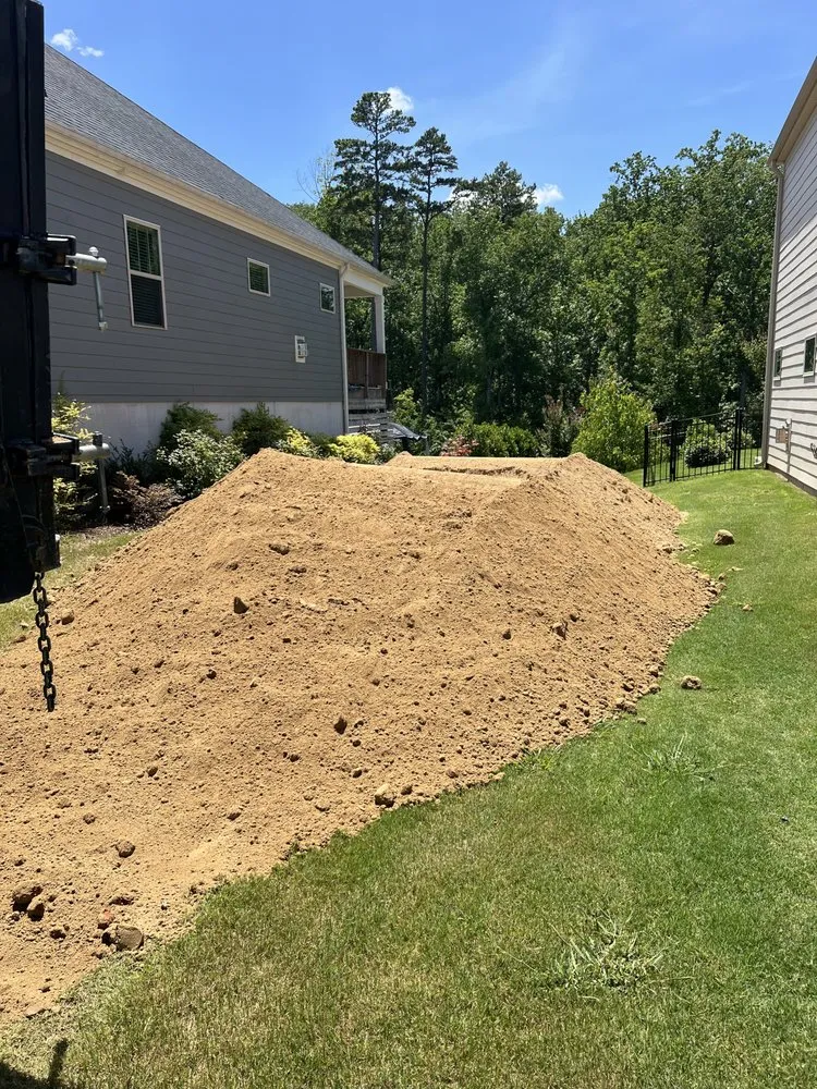 Affordable yard cleanup service with custom design in Mount Holly, NC by Solid Rock Trucking