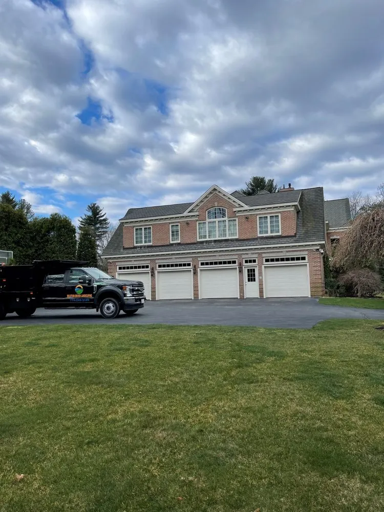 Custom landscape installation in Marlborough, MA by Solution Driven Landscaping