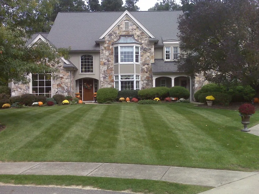 Local lawn mowing service for outdoor upgrades in Gibsonia, PA by Solutions Landscapes & Designs, LLC