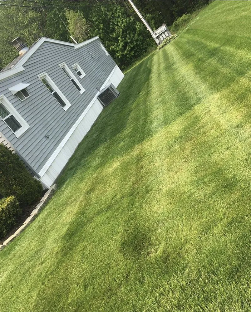 Affordable lawn mowing service with custom design in York, ME by Sons Lawn Care