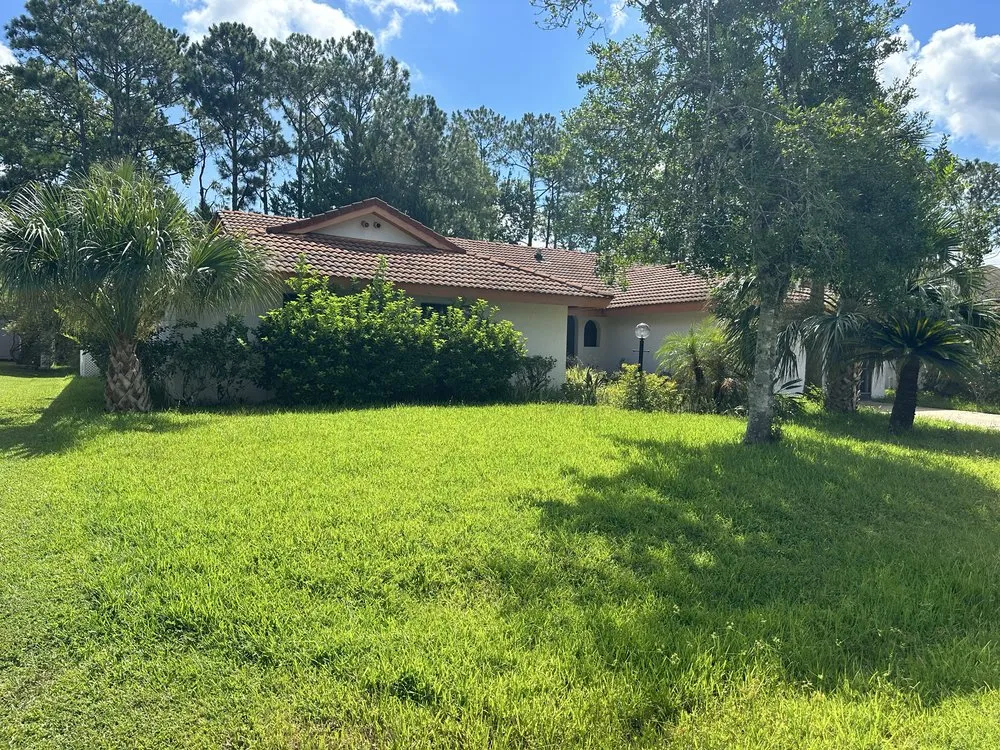 Custom garden landscaping with custom design in Florahome, FL by Southern Sons Lawn Care