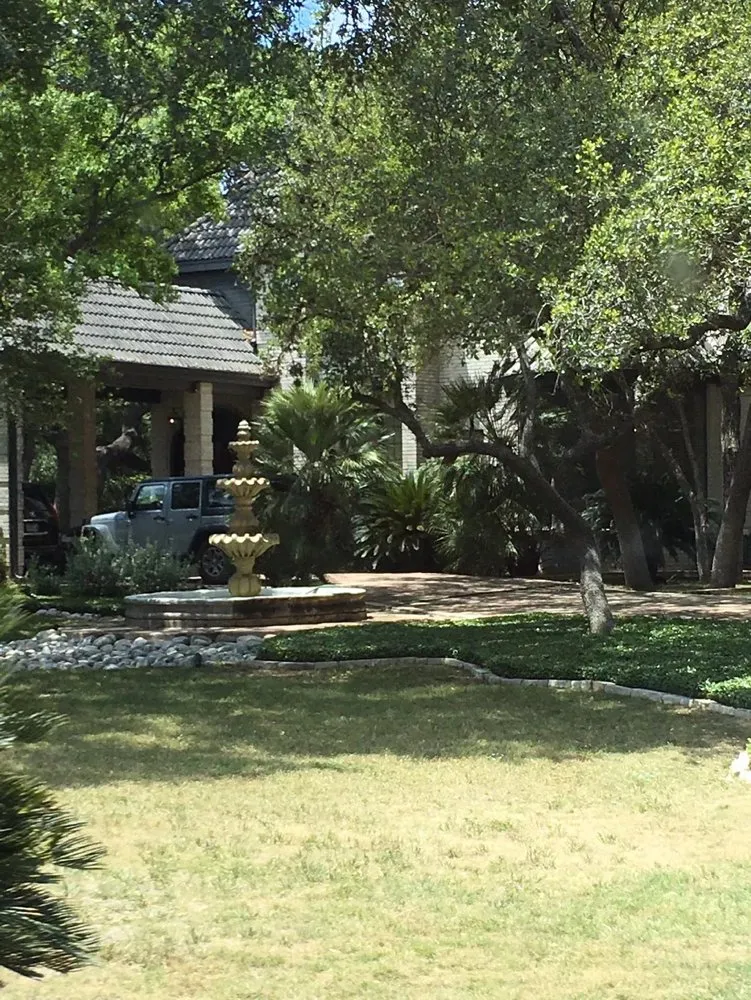 Top-rated lawn mowing service with custom design in San Antonio, TX by Spoolin 210 Services