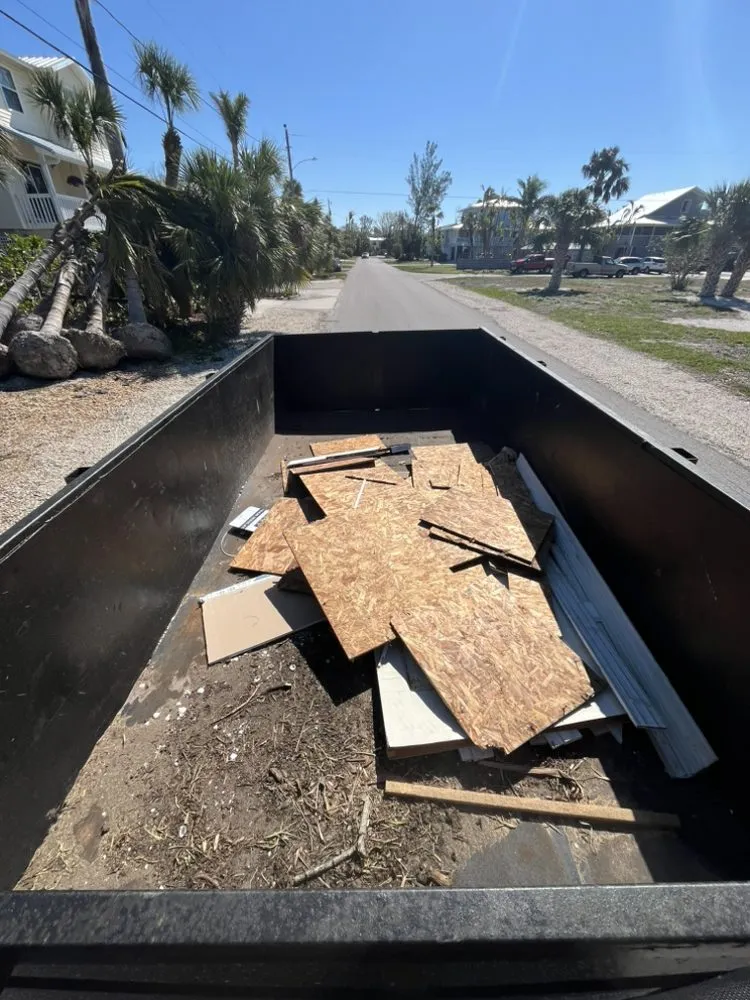 Professional landscape installation with custom design in Anna Maria, FL by S&S Hauling