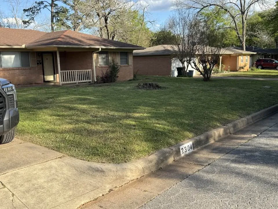 Expert yard maintenance for residential properties in Tyler, TX by Stewart Loves Lawns