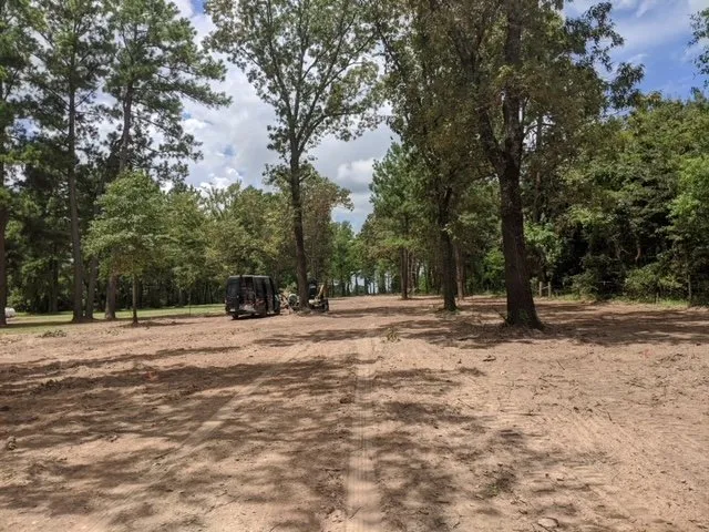 Custom landscape design for residential properties in Montgomery, TX by Sticks and Stones Land Management