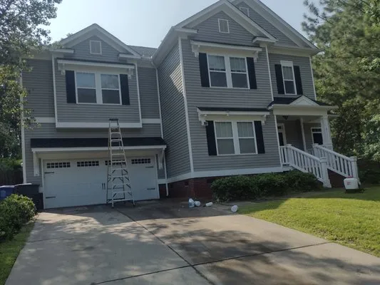 Stomper Lawn Care N Pressure Washing Service Logo