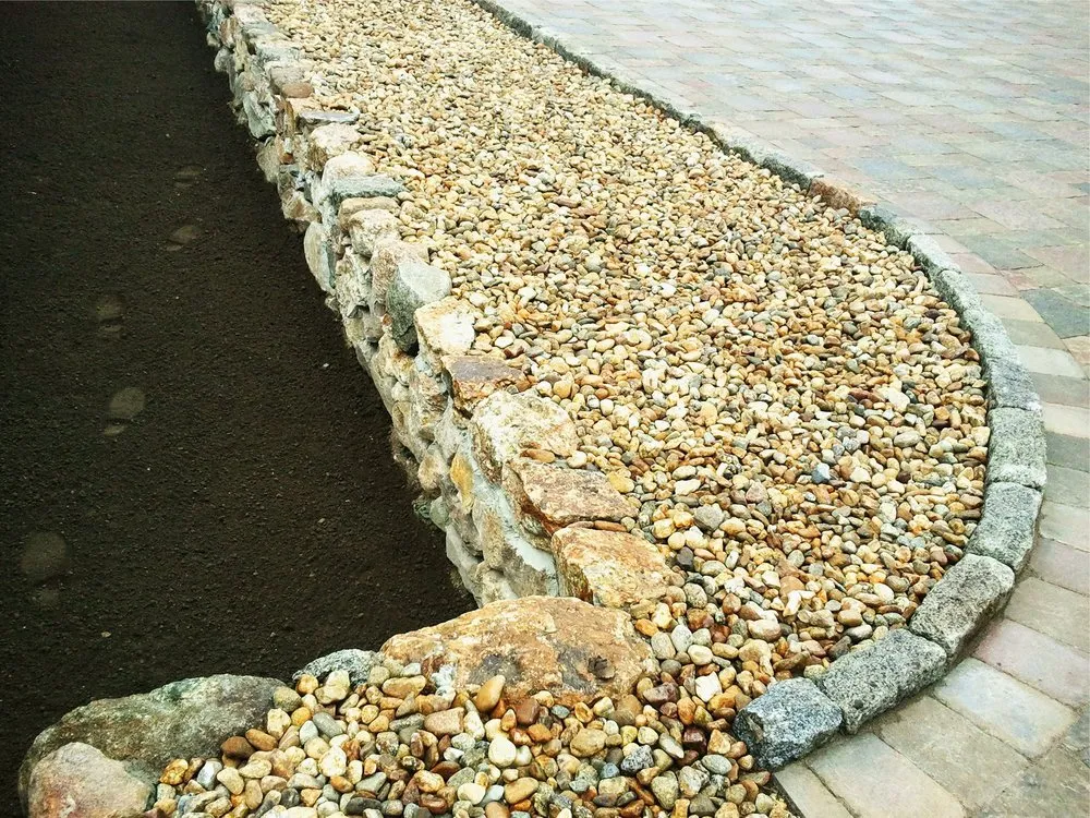 Custom outdoor landscaping in Stow, MA by Stone Wall Designers