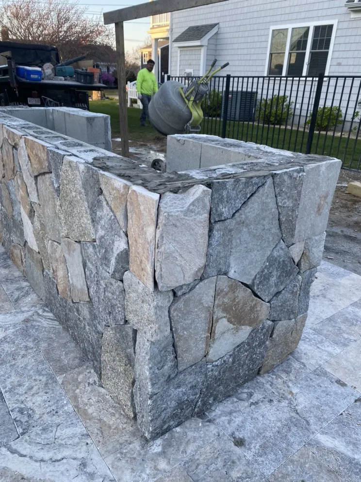 Custom landscape installation for homes in Barnstable, MA by StoneArt Masonry & Landscaping