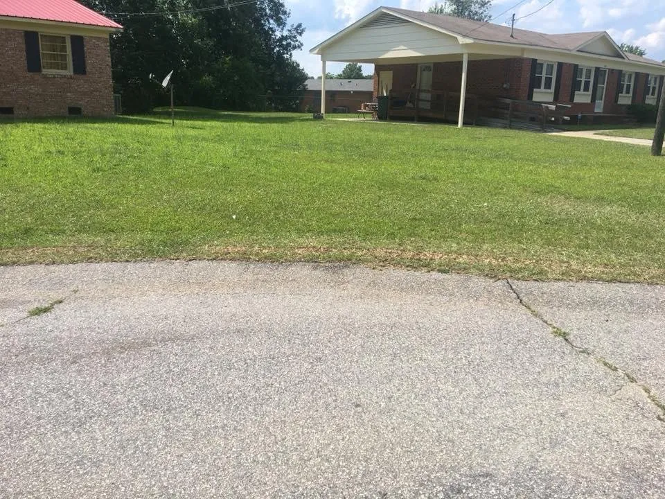 Affordable lawn care service for beautiful yards in Fayetteville, NC by Stones Home Improvement and Lawn