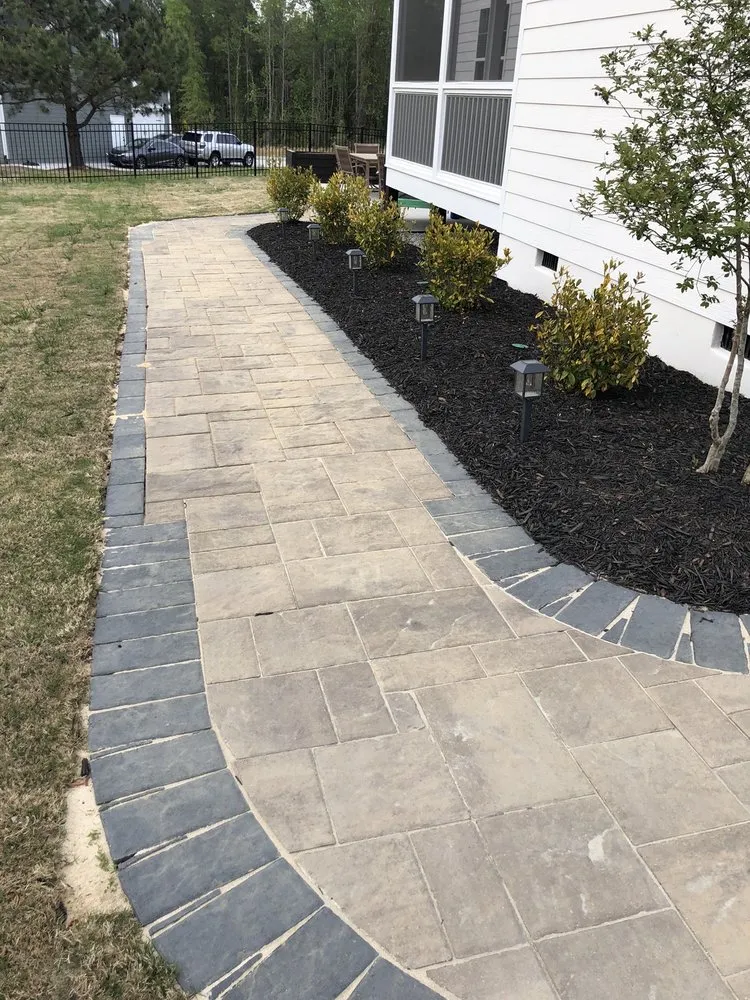 Reliable lawn mowing service for outdoor upgrades in Holly Springs, NC by Stonetree Building Group