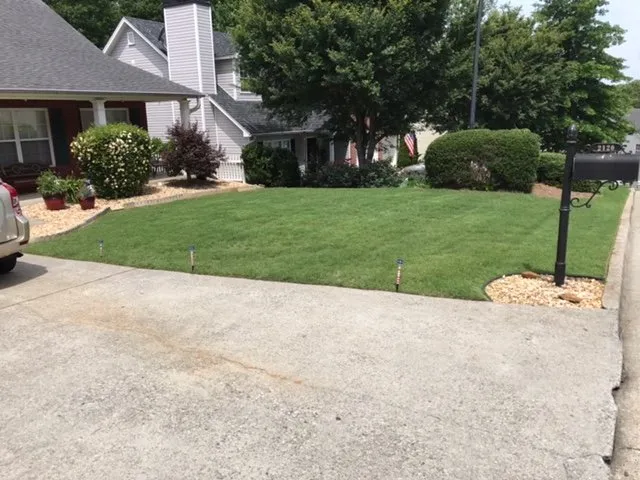 Affordable lawn mowing service in Loganville, GA by Strong Arm Landscaping