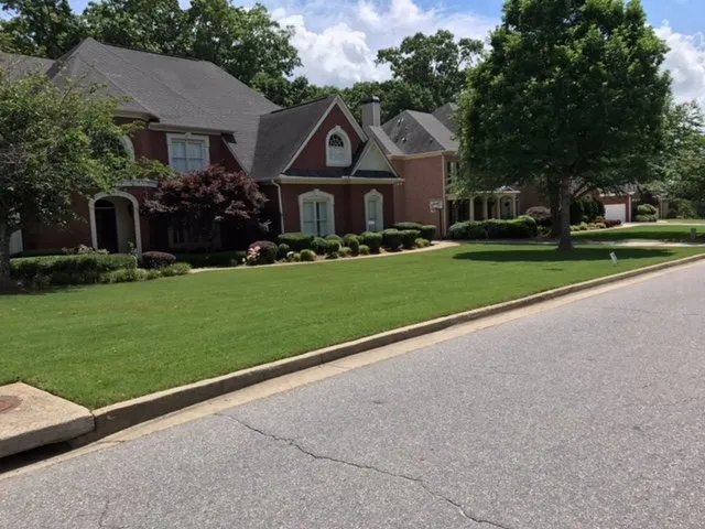 Local landscape installation with custom design in Loganville, GA by Strong Arm Landscaping