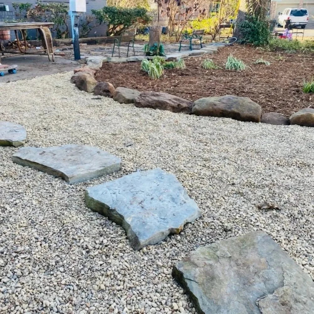 Professional outdoor landscaping for residential properties in Norman, OK by Stunnin Greens