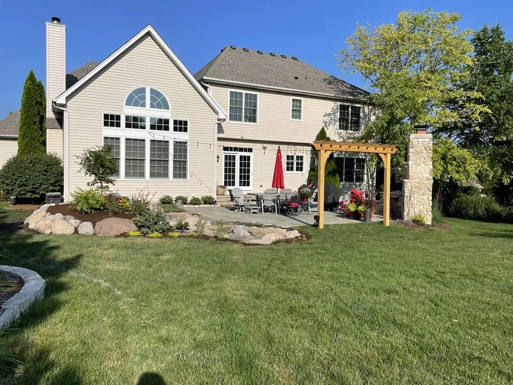 Custom yard cleanup service for year-round maintenance in Elburn, IL by Suburban Lawn