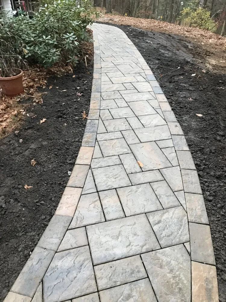 Expert lawn mowing service for homes across Hudson, MA - Sudbury Stone & Hardscape