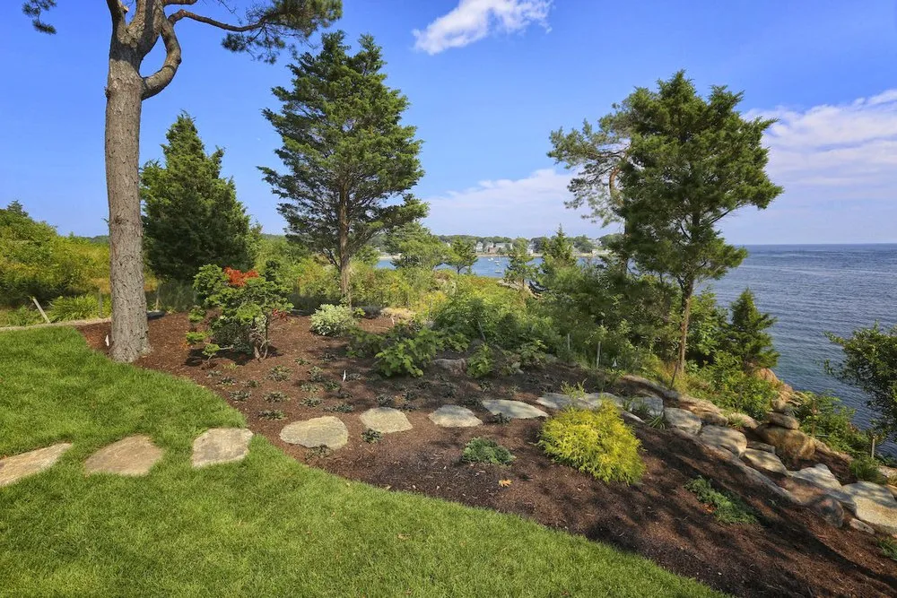 Custom yard cleanup service for beautiful yards in Essex, MA by Sullivan Landscape & Stone