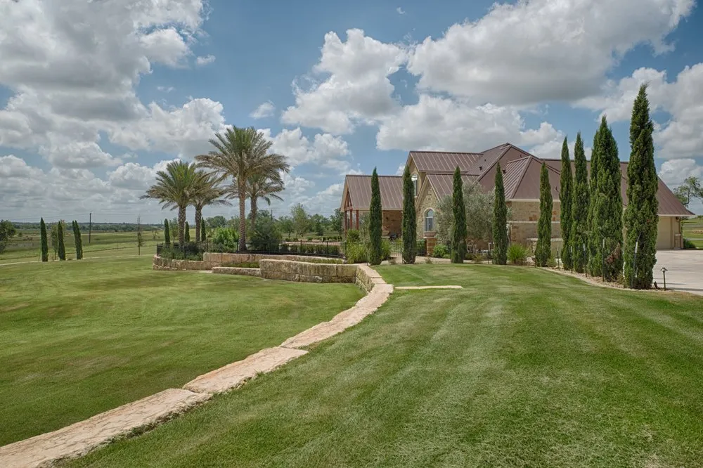 Local yard cleanup service for year-round maintenance in Hondo, TX by Summit Landscape and Design