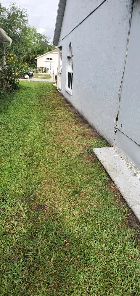 Expert lawn mowing service for residential properties in Orlando, FL by SunnySide Lawn Care