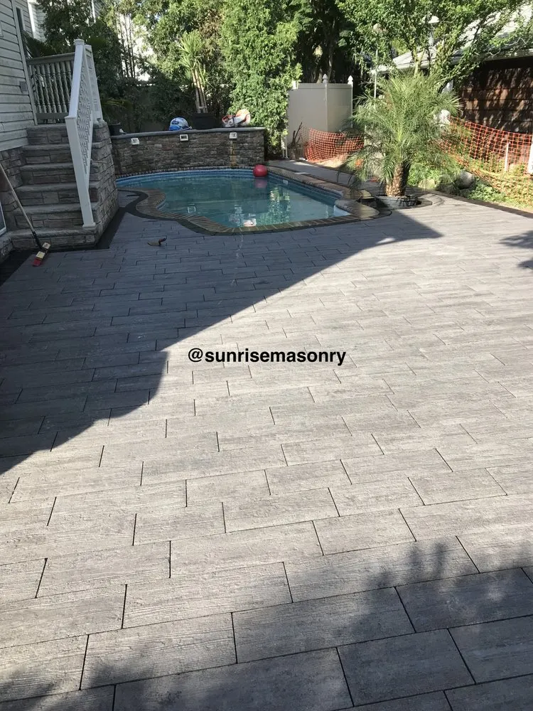 Custom lawn mowing service for year-round maintenance in Staten Island, NY by Sunrise Masonry & Concrete