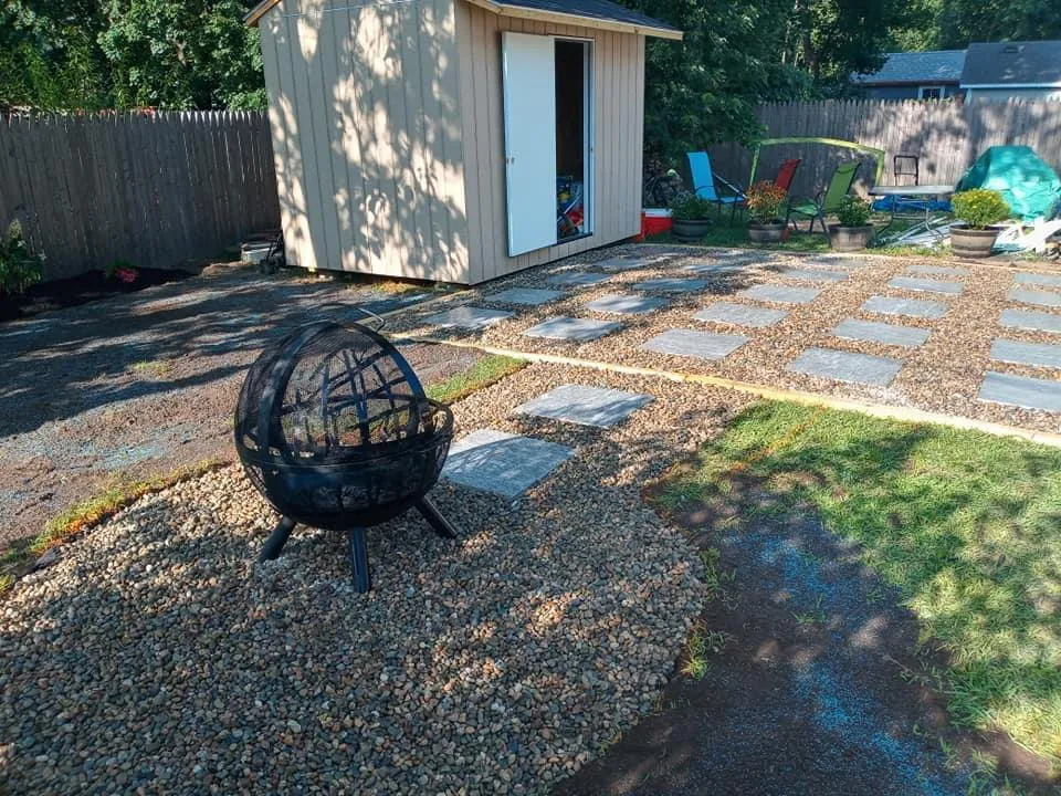 Local yard cleanup service for year-round maintenance in Rockland, MA by Sunset Landscape and Construction