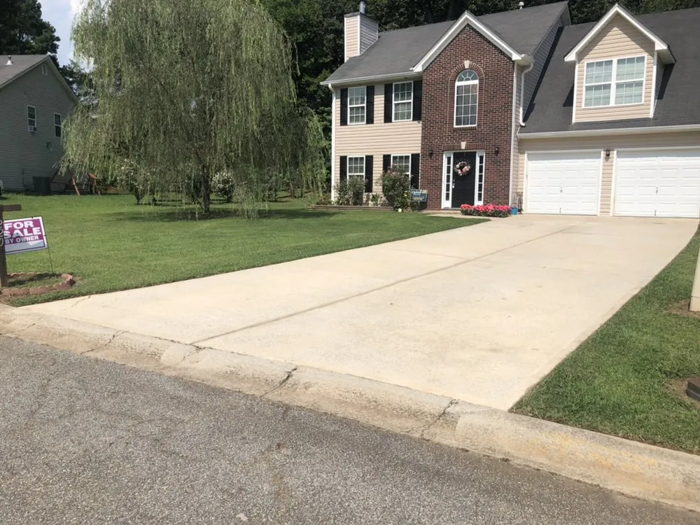 Expert lawn mowing service for residential properties in Douglasville, GA by Superior Pressure Washing Metro