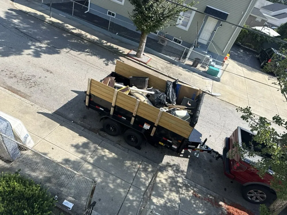 Local yard cleanup service for residential properties in Pawtucket, RI by Supreme Junk & More