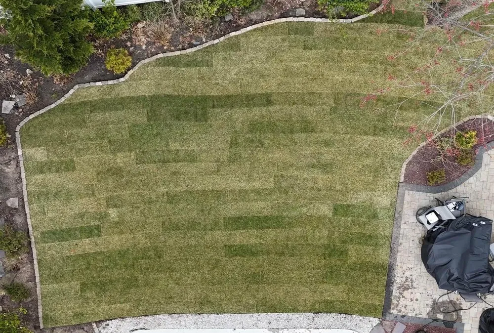 Custom landscape installation for homes in East Brunswick, NJ by Supreme Outdoor Maintenance