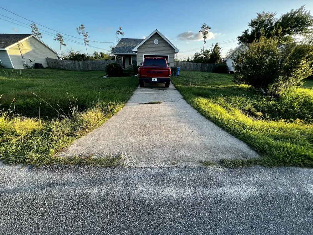 Trusted lawn mowing service with custom design in Panama City, FL by Surface Correction Services