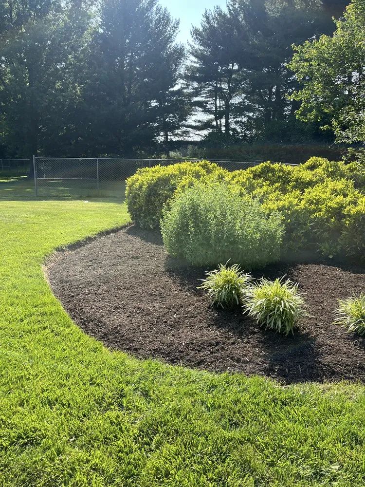 Custom lawn mowing service with custom design in Fairfax, VA by Surgescaping