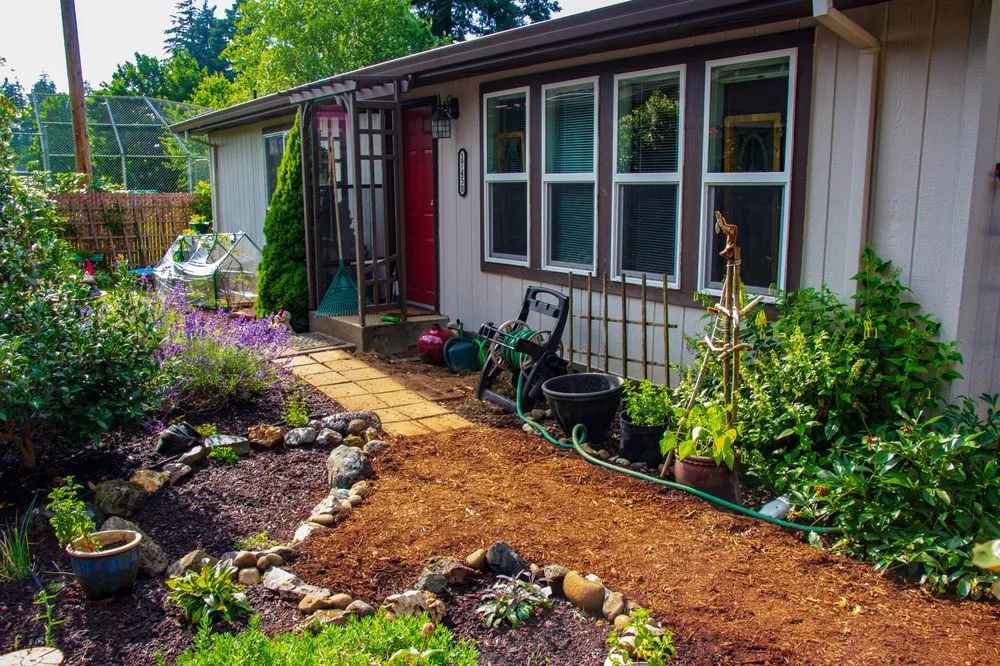 Affordable lawn mowing service for homes in Portland, OR by SymbiOp Landscaping