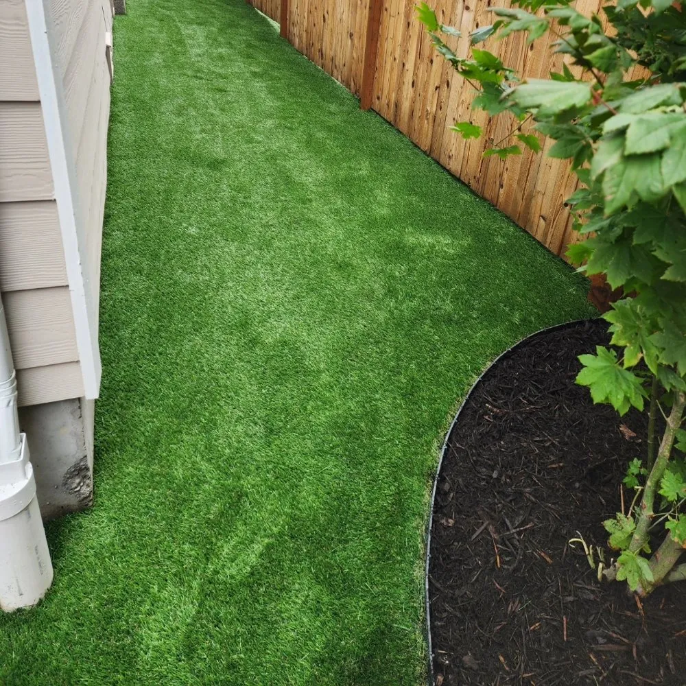 Affordable landscape installation for beautiful yards across Seattle, WA - Synthetic Turf Sprinklers Retaining Wall Drainage